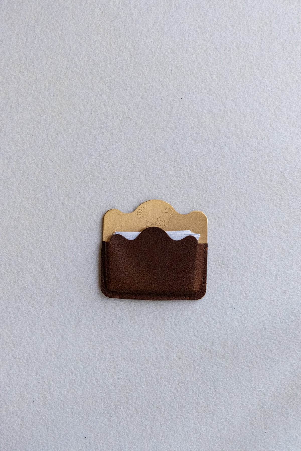 Brass card holder with brown leather
