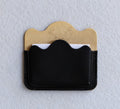 Brass card holder with black leather